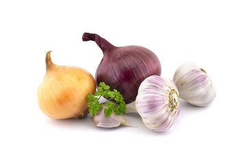 Garlic bulbs, cloves and red yellow onion on white