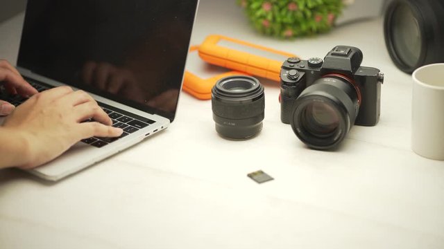 close up of hand insert the MMC card to the laptop