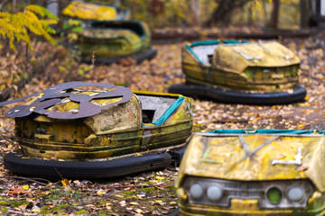 Bumper cars in abandoned amusement park in Pripyat, Chernobyl Exclusion Zone in autumn