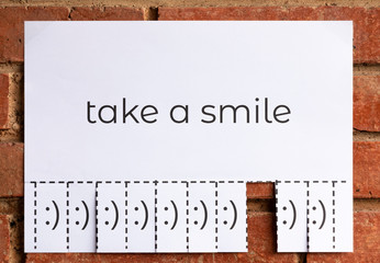 Poster of an Advertise "Take a Smile" to Tear off