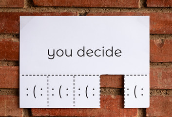 Poster of an Advertise ""You Decide" to Tear off
