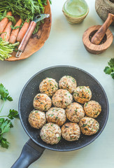 Tasty roasted buckwheat balls in frying pan on kitchen table background. Top view. Healthy home vegan food concept