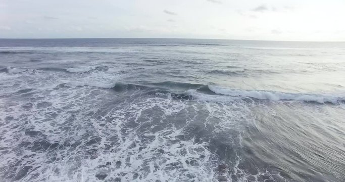 Aerial view of sea waves in hindia ocean in parangtritis beach,indonesia