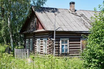 Fototapeta na wymiar A typical village house in the countryside in Russia