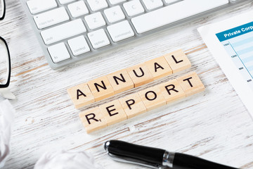 Annual report concept with letters on cubes