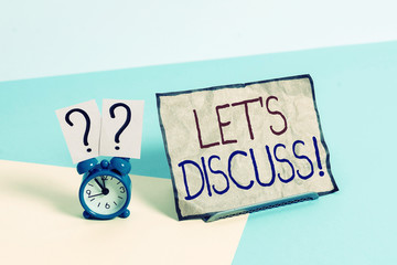 Writing note showing Let S Discuss. Business concept for asking someone to talk about something...
