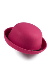 Close up shot of a pink bowler hat with the black leather ribbon around a crown and with a metal...