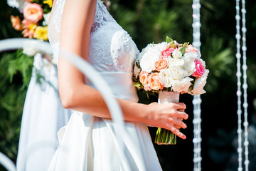 Bouquet wedding with roses in bride hands Close up