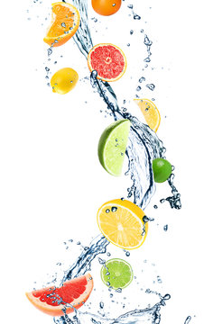 Different Falling Citrus Fruits And Splashing Water On White Background