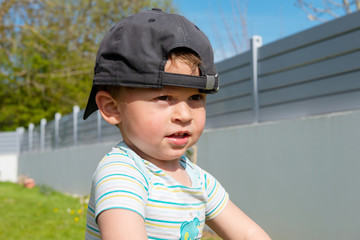 portrait of child three years old, outdoors