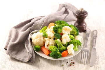 plate with vegetable- cauliflower, broccoli and carrot