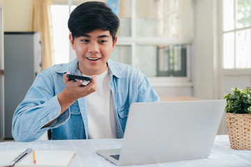 Young man talking with handfree on the phone.