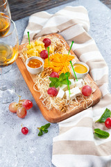 assorted cheese on a wooden background