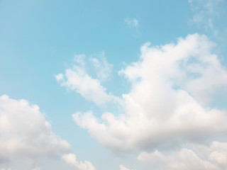Large clouds floating in the blue sky.The weather is clear today.subtle background