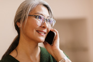 Pretty mature beautiful grey-haired woman