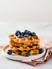 Easy healthy gluten free oat waffles with copy space. Stack of appetizing homemade waffles with oat...