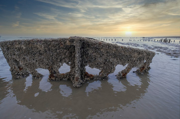 A special picture of the wreck of Wierum with spectacular clouds, the wadden sea in spring condition