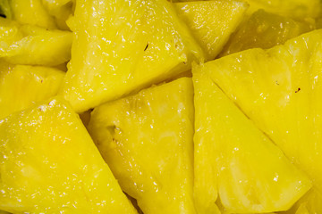 Pieces of chopped pineapple for the background