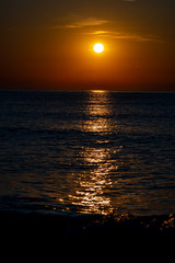 Fototapeta premium the sun reflected at sea at sunrise