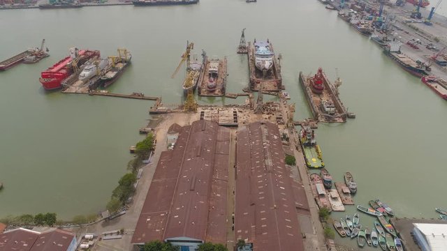aerial view cargo and passenger seaport with ships and crane Tanjung Perak, surabaya, indonesia. docks for the repair and parking of ships, cargo port and container terminal. ship in industrial port