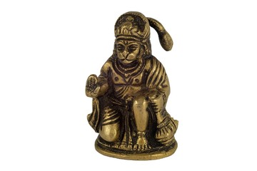 Aged yellow metal bronze statuette of Indian deity Hanuman closeup isolated on a white background