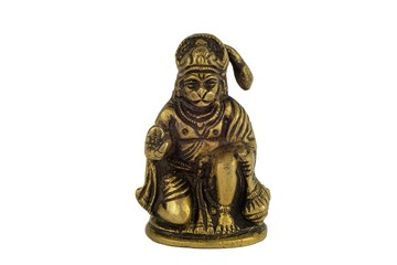 yellow metal bronze statuette of indian deity Hanuman closeup isolated on a white background