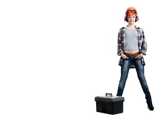 Girl in a construction helmet, noise-insulating headphones with a tool box
