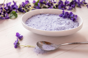 Fototapeta na wymiar viola violet violetta odorata fresh petal sugar bath spa salts from spring blossom flowers 