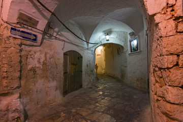 Night view of the streets of the historic center of the white city of Ostuni in Puglia, Italy.