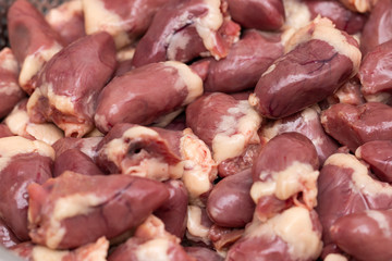 fresh chicken hearts as background