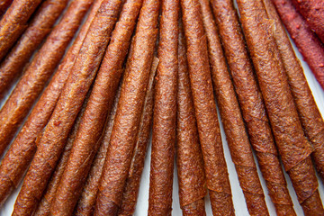 Sweet pureed fruit pastille. Fruit roll-ups homemade. Natural sweets from dried berries and fruits.