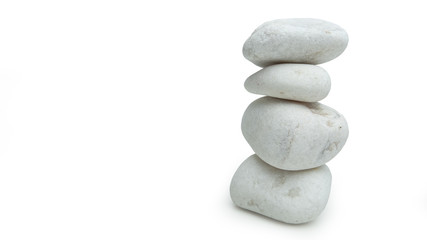 Fototapeta na wymiar White stones balanced in tower, isolated on white background with soft shadow. Minimalist ornament signifying simplicity.