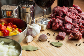 beef goulash ingredients: meat, paprica, onion, garlic, red wine and spices