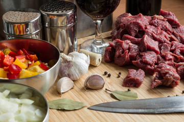 beef goulash ingredients: meat, paprica, onion, garlic, red wine and spices