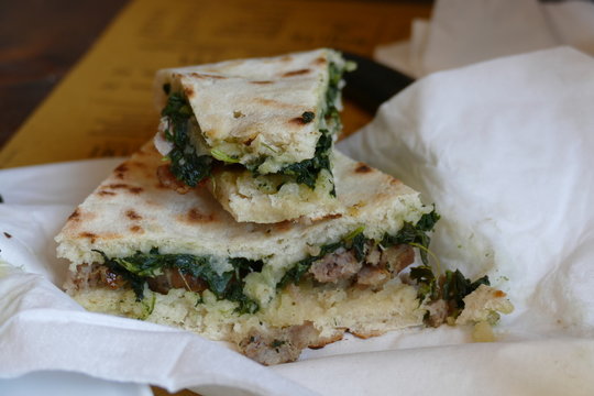 slices of Torta al Testo with meat and vegetables