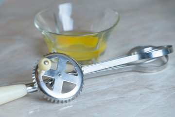 Beat eggs in a transparent plate, hand mixer