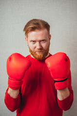 Business man ready to fight with boxing gloves