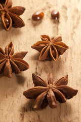 star anise on a wooden textured background