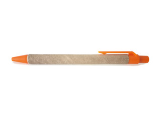 Recycled, biodegradable cardboard pen with push button and orange clip isolated on white...