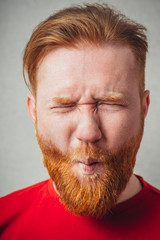 Man sucking in his cheeks