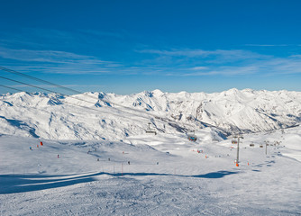 View down a piste in alpine ski resort