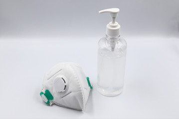 Alcohol Gel Hand and Disposable Hygienic or medical Mask for hand hygiene corona virus protection on white background . 