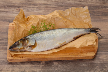 Salted herring over the wooden board