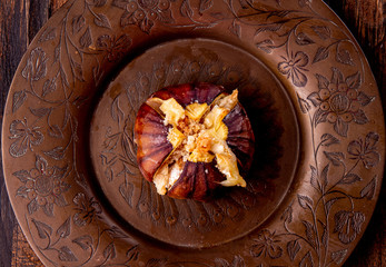 Ripe figs baked with cow's-milk cheese brie and camambert and sprinkled with bread crumbs on...