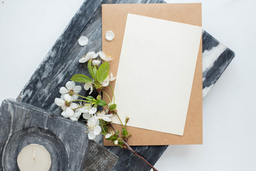 cards branding mockup template on dark marble background, with flowers. place for your design....