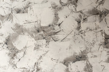 relief white-grey background with a pattern of grey and white paint in daylight