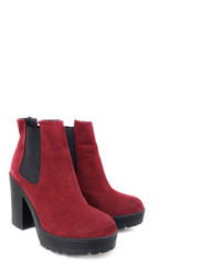 Female dark red suede boots on white background, isolated product, top view. heeled shoes