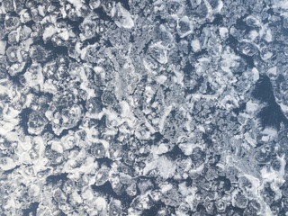 Aerial view on ice texture of the frozen lake