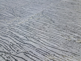 Aerial view on ice texture on the surface of the ice on a lake