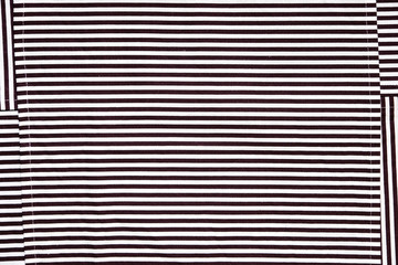 Towels and table napkins with stripes. Hypnotic design black and white.